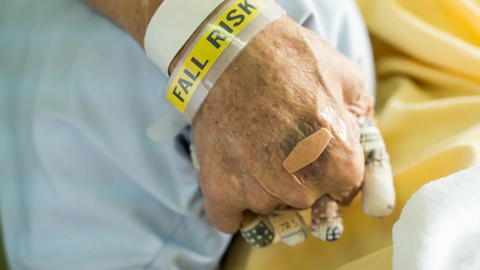 Elderly person with falls risk wrist band