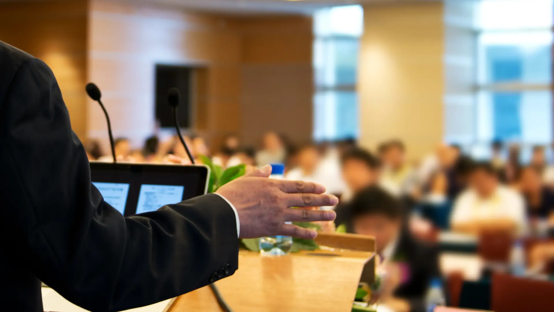 Person speaking at a podium