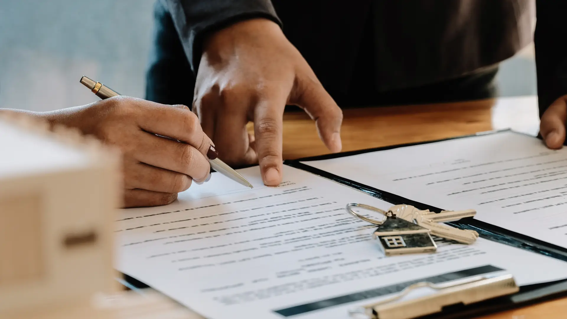 A person signing a real estate agreement